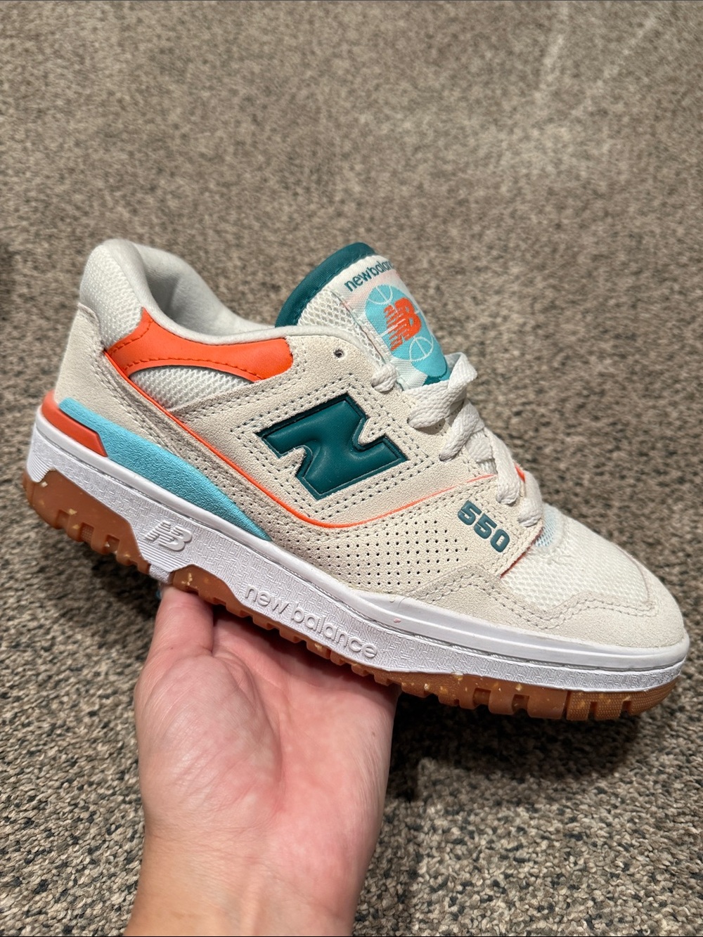 New Balance Women's 550 Sneakers in Cream with Teal & Orange Accents